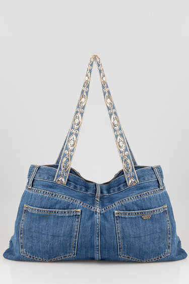 blue denim bag with decorative patterned straps and two back pockets