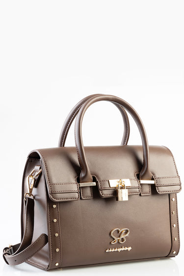 brown leather tote bag with two top handles and gold hardware, buckles, and studded side accents by Blue Jean Traders