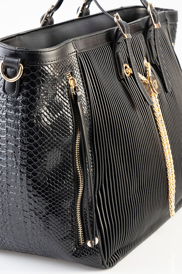 black handbag with snakeskin texture on the sides and a pleated front, gold chain handle and hardware by Blue Jean Traders