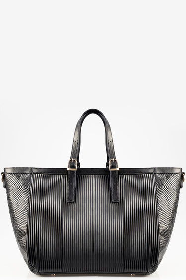 Blue Jean Traders tote bag with black vertical pleats, two short handles, gold hardware, and textured side panels