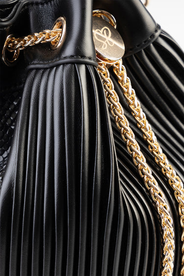 black pleated bucket bag with a gold chain strap and round gold emblem