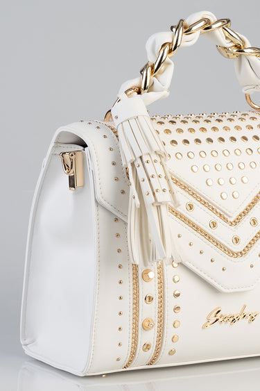 white tote bag with gold studs and a chunky gold chain handle by Blue Jean Traders with fringe tassel detail