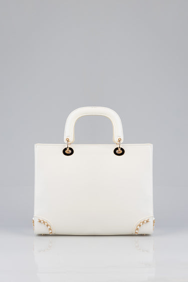 white structured briefcase bag by blue jean traders with rounded top handles and gold hardware