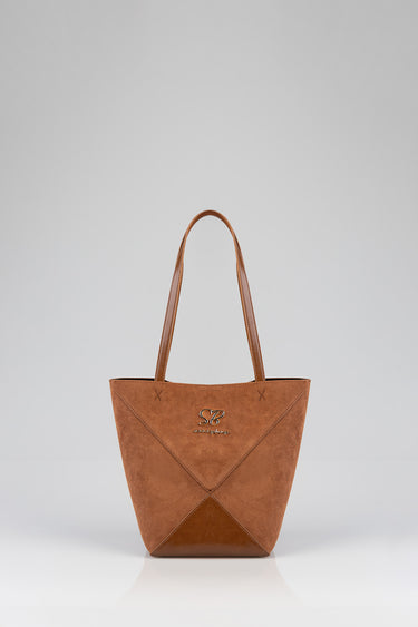 brown suede shopper bag with two long straps and geometric panel stitching, small metallic logo on front