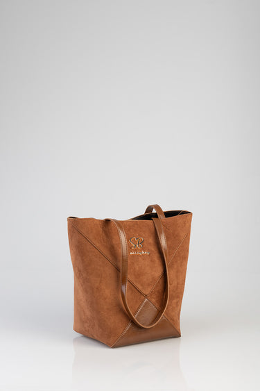 brown suede shopper bag with double handles and a stitched panel design, gold logo on the front