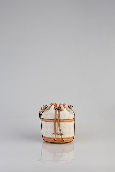 mini bucket bag in beige patterned canvas with caramel leather trim and gold hardware by Blue Jean Traders