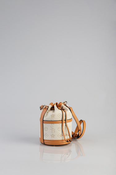 mini debossed bucket bag in cream with tan leather trim and drawstring top by Blue Jean Traders