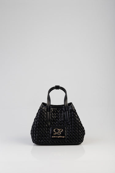 black woven mini tote bag with two top handles and a gold logo plate on the front