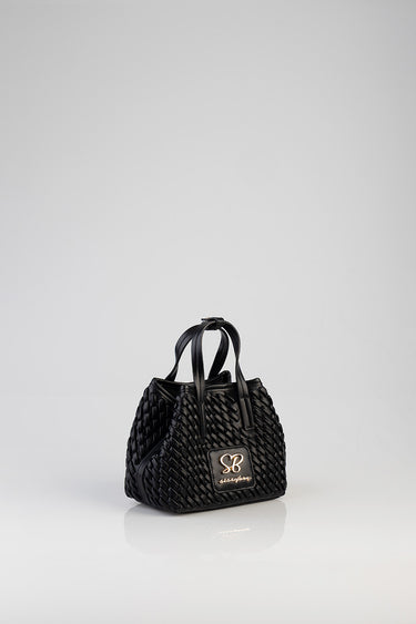 black textured mini tote bag with a woven pattern, two handles and a front logo plaque