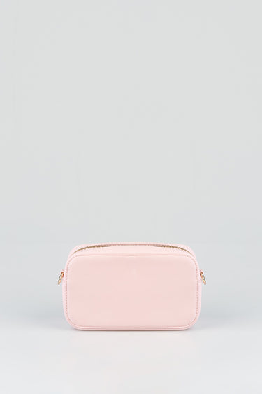 pink crossbody bag by Blue Jean Traders with gold zipper and pebbled texture