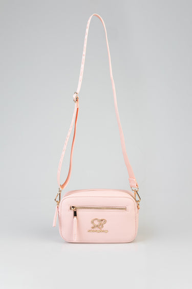 pink crossbody bag with gold hardware, front zip pocket and logo emblem, adjustable strap