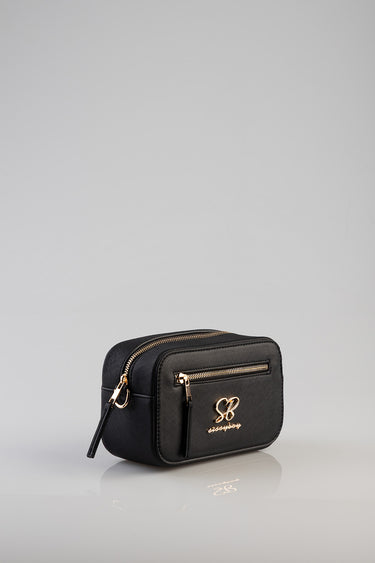 black compact crossbody bag with gold hardware and front zip pocket