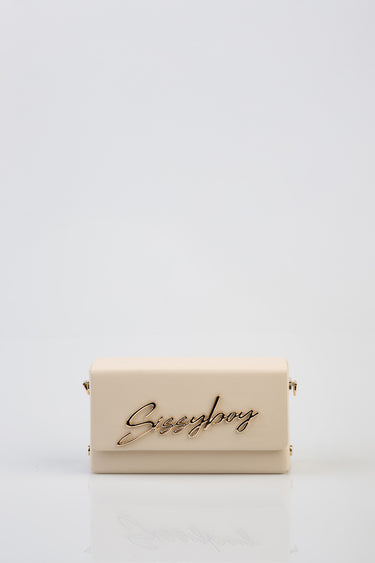 beige rectangular handbag with a gold script logo reading Siggyboy on the front, small gold hardware on the sides, against