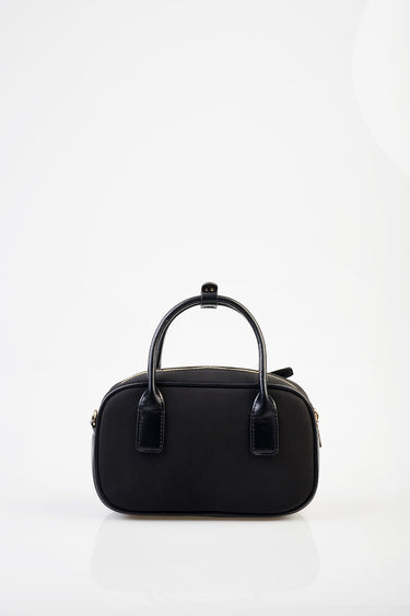 blue jean traders black compact bowler bag with top handles and gold hardware on white background