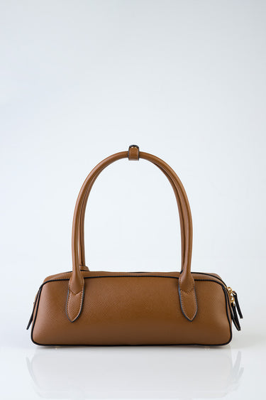 brown leather shoulder bag with two top handles and gold hardware on a plain white background