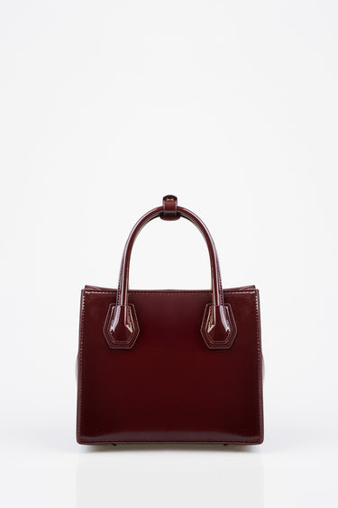 blue jean traders burgundy patent leather tote with rounded top handles and visible stitching