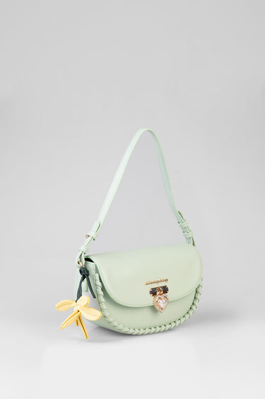 mint green shoulder bag with braided trim, gold heart charm, and a yellow bow tassel