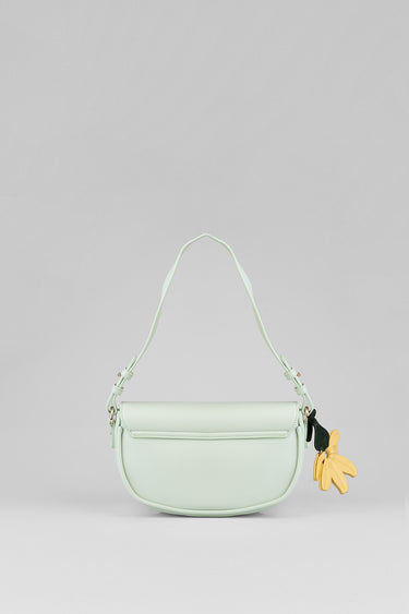 mint green saddlebag with curved flap and slim strap with a yellow flower charm