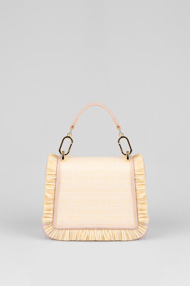beige handbag with pink trim and fringe along the edges, top handle and gold hardware