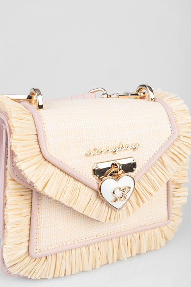 beige fringe crossbody bag with textured fabric, pale pink trim and a heart shaped lock by Blue Jean Traders