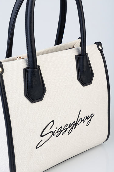 beige canvas handbag with black leather handles and trim, gold hardware, front cursive logo