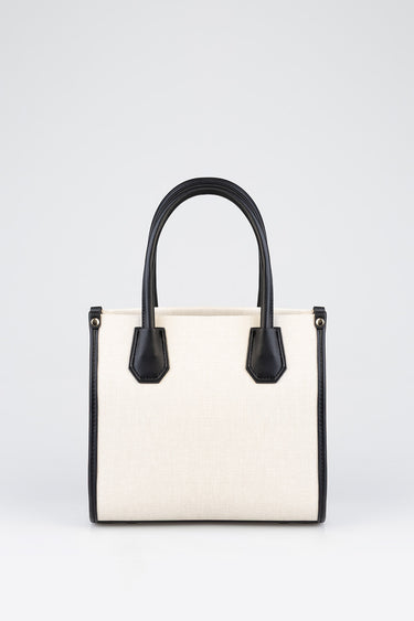 Blue Jean Traders canvas bag with black leather trim and handles beige body