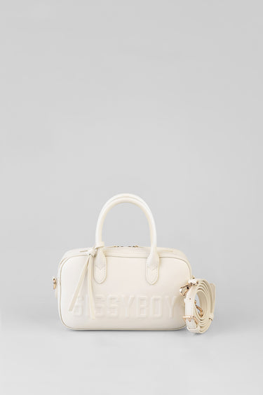 cream bowler bag with two top handles and a detachable strap, embossed lettering on the front