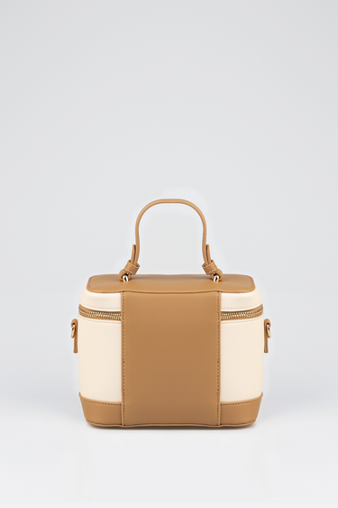 tan and cream two tone mini vanity bag with top handle and gold zipper