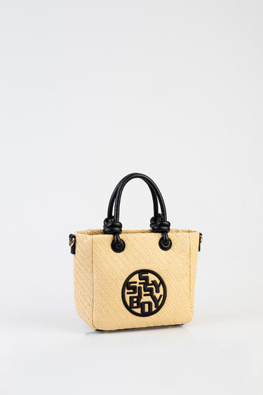 beige woven straw tote with black handles and round black logo patch