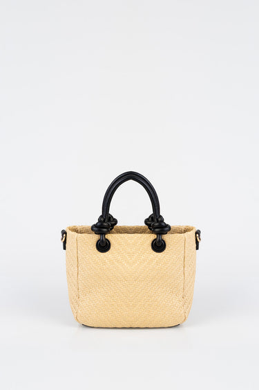 beige woven bag with black rounded handles and knot details