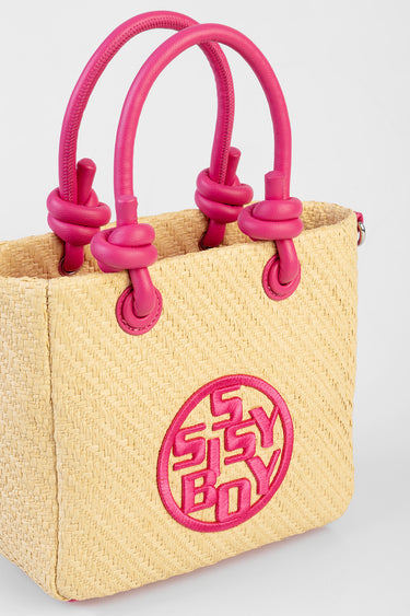beige woven straw tote with bright pink knotted handles and round pink logo
