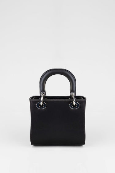 black mini bag with rounded top handle and silver ring hardware