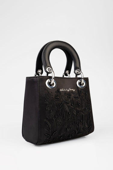 black mini bag with embroidered floral pattern and silver ring handles