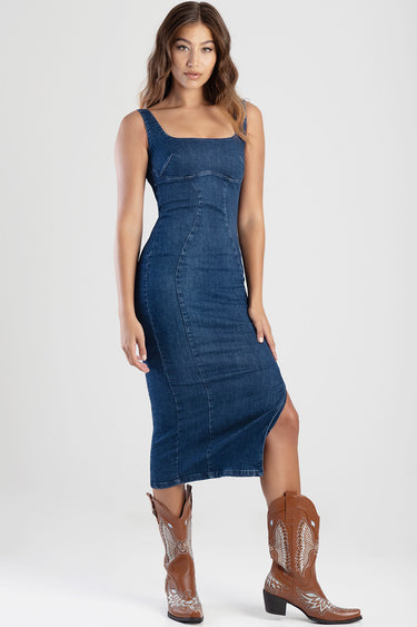 blue denim dress with square neckline and contoured seams, sleeveless midi length, shown with brown western boots