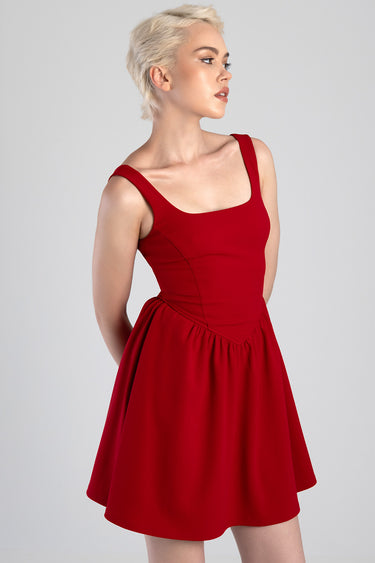 red sleeveless mini dress with wide straps, fitted bodice and pleated flare skirt