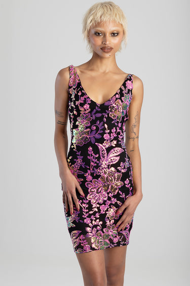 model wearing a black sequin floral mini dress with pink and purple flowers and thin straps