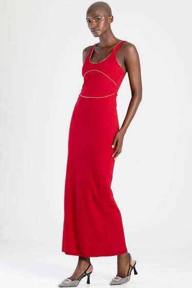 red maxi dress with white curved seam details at the bust and waist, sleeveless with thin straps, model in heeled sandals.