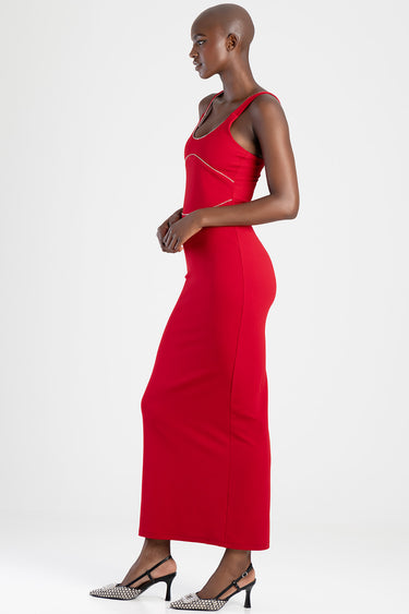 model wearing a red maxi dress with thin straps and white piping detail, full length, paired with black and white patterned