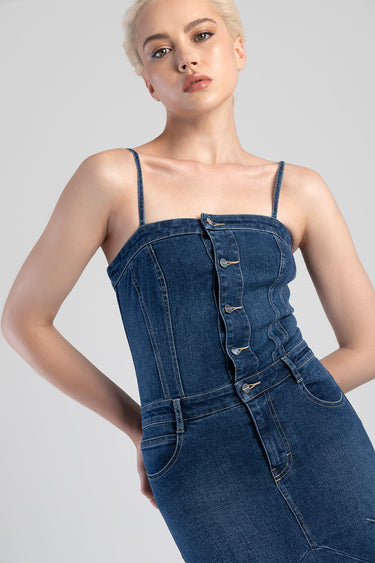 blue denim dress with spaghetti straps, vertical button placket, fitted waist on a model