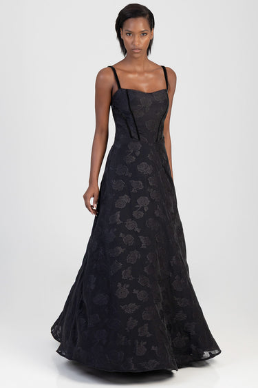 model wearing a black floral maxi dress with thin straps, full length gown