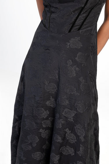 black jacquard maxi dress with a subtle rose pattern and a fitted bodice