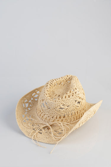 beige straw cowboy hat with open weave and tied string bow