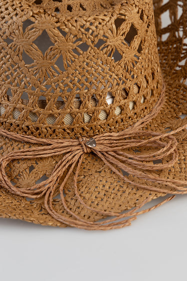brown straw cowboy hat with an open woven lattice pattern and a braided cord tied around the base