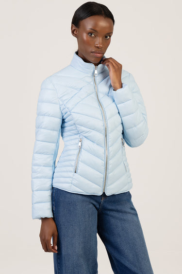 light blue puffer jacket with diagonal quilting, full front zipper, stand collar and zip pockets, model wearing jeans