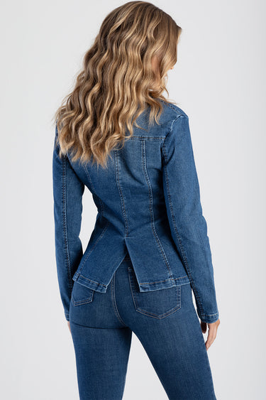 woman in blue denim blazer with fitted waist and back peplum rear view