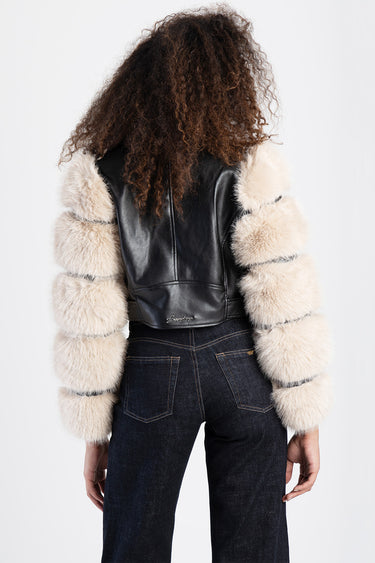 black leather jacket with thick beige fur sleeves on a model facing away