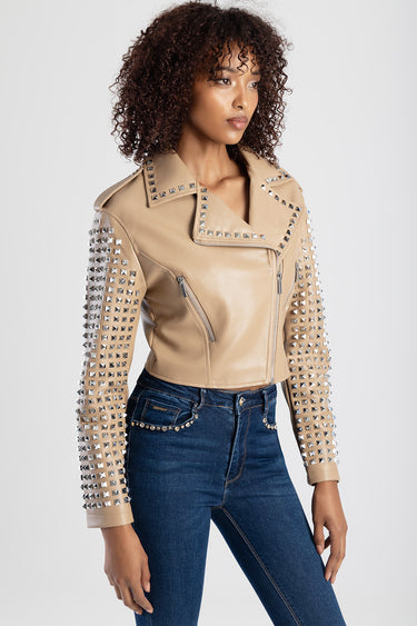 beige leather biker jacket with silver stud embellishments on lapels, shoulders and sleeves, cropped fit with zip pockets.