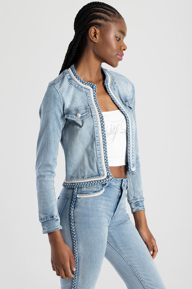light wash denim jacket with braided trim, cropped fit, worn by a woman in a white top and matching jeans