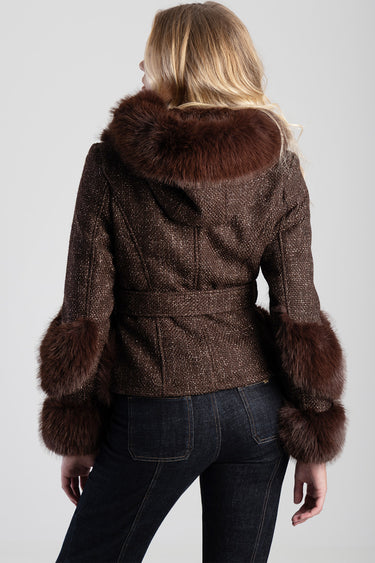 back view of brown tweed jacket with a fur hood and fur cuffs
