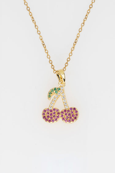 gold chain necklace with a cherry pendant encrusted with colorful stones, green leaf and pink jewels
